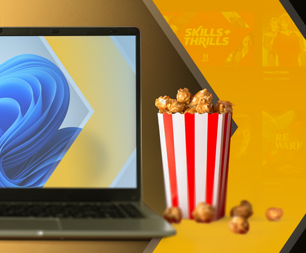 A Windows 11 laptop next to a striped popcorn bucket, with the Plex logo and blurred streaming content in the background.