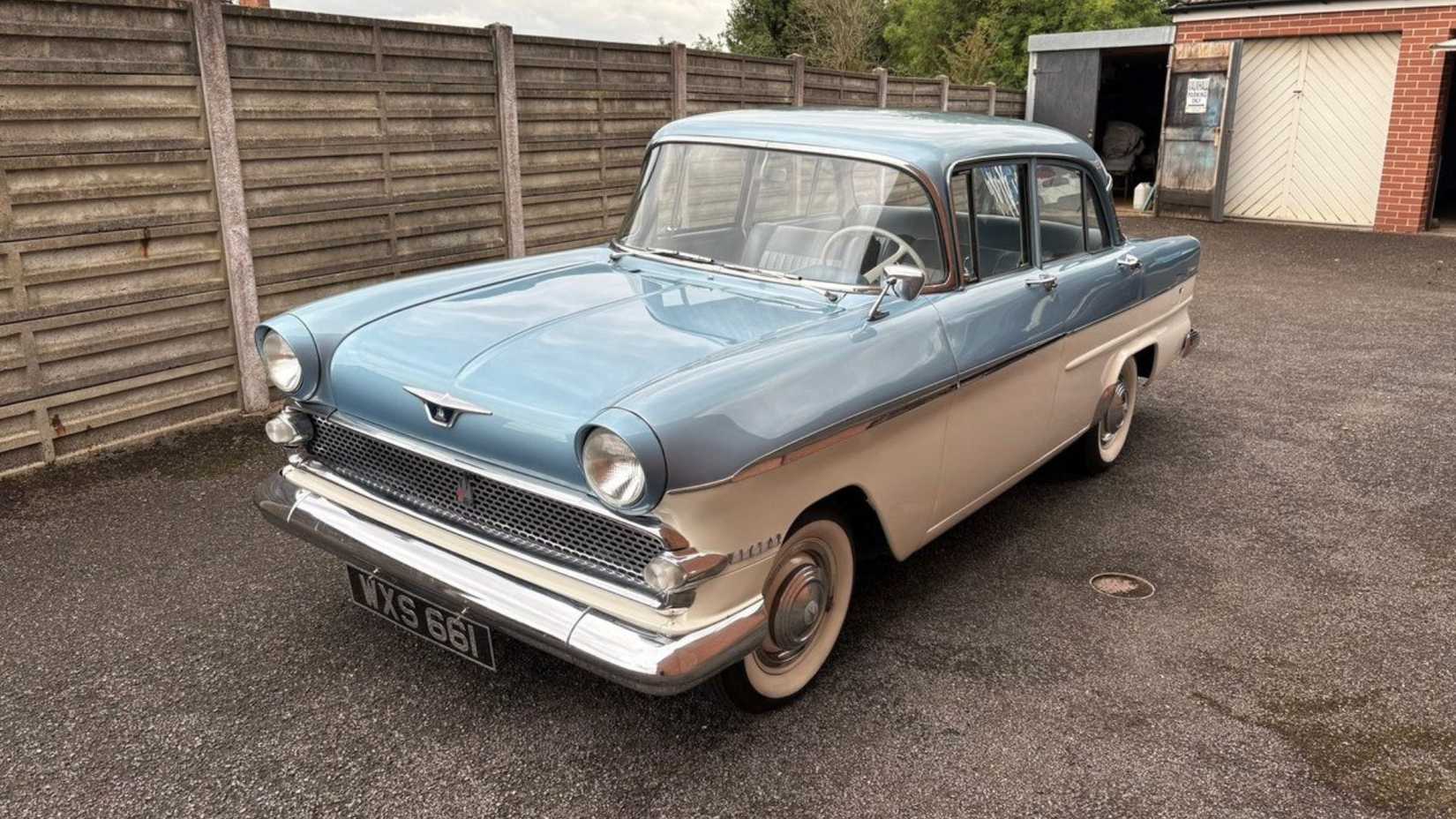 Static frotn 3/4 shot of a blue and white 1960 Vauxhall Victor.