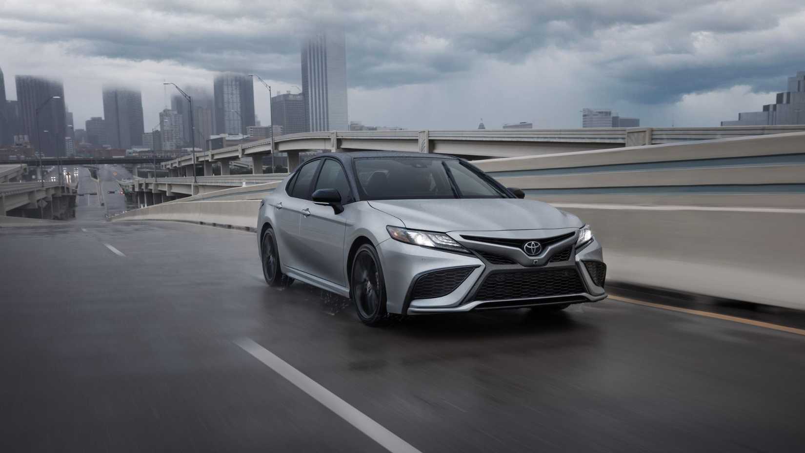 Dynamic front 3/4 shot of a silver 2024 Toyota Camry XSE AWD.