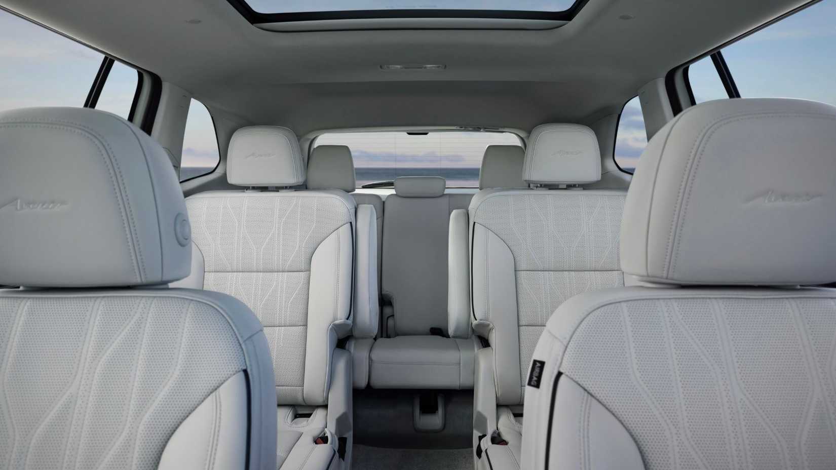 Shot inside the cabin of a 2025 Buick Enclave Avenir showing the three rows of seating.