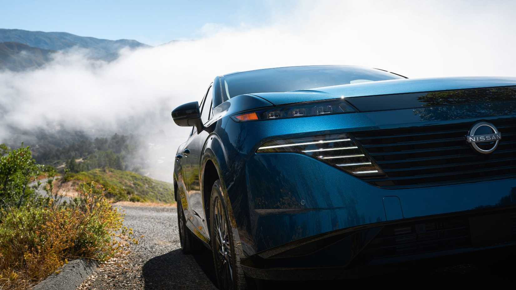 Close-up front-end shot of a blue 2025 Nissan Murano.