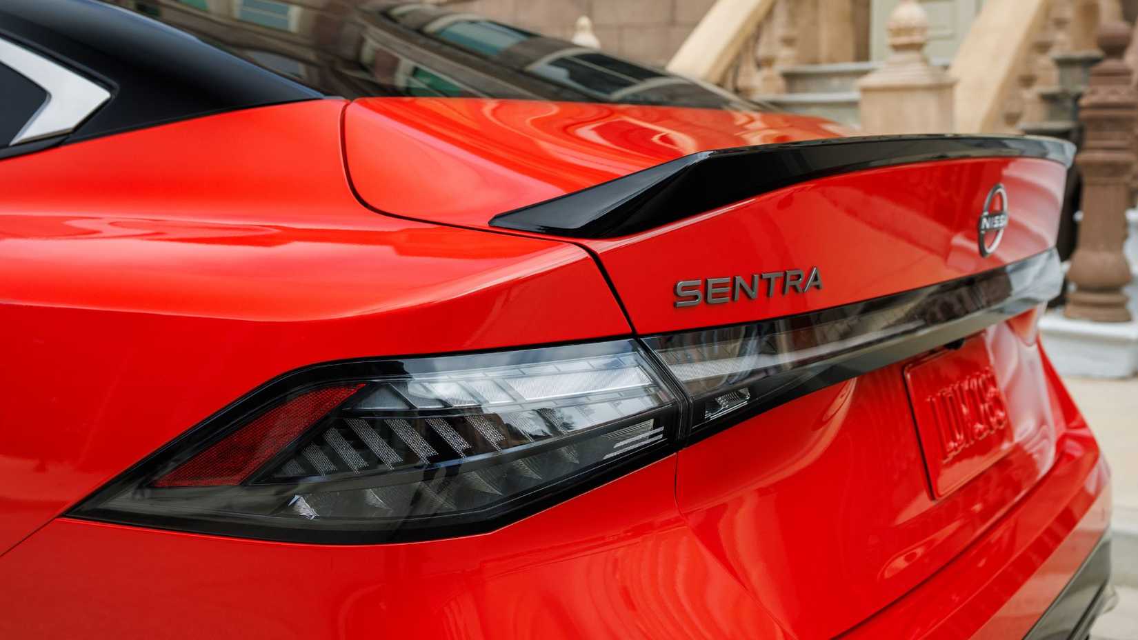 Close-up shot of the spoiler on the trunk of a red 2026 Nissan Sentra.