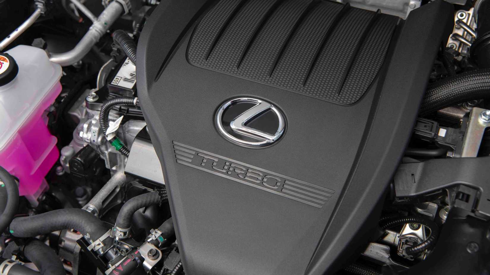 Close-up shot of the turbo engine under the hood of a 2026 Lexus NX.
