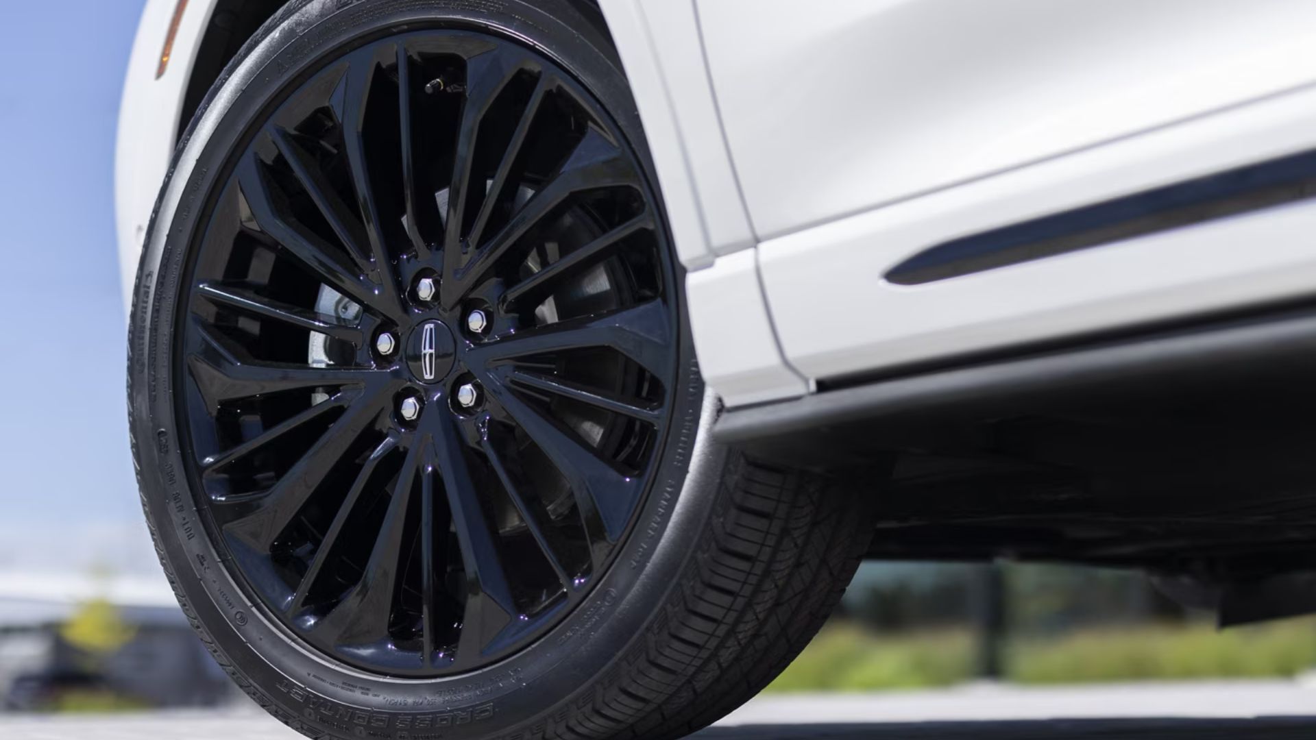 Close-up shot of the alloy wheel on a white 2026 Lincoln Corsair.