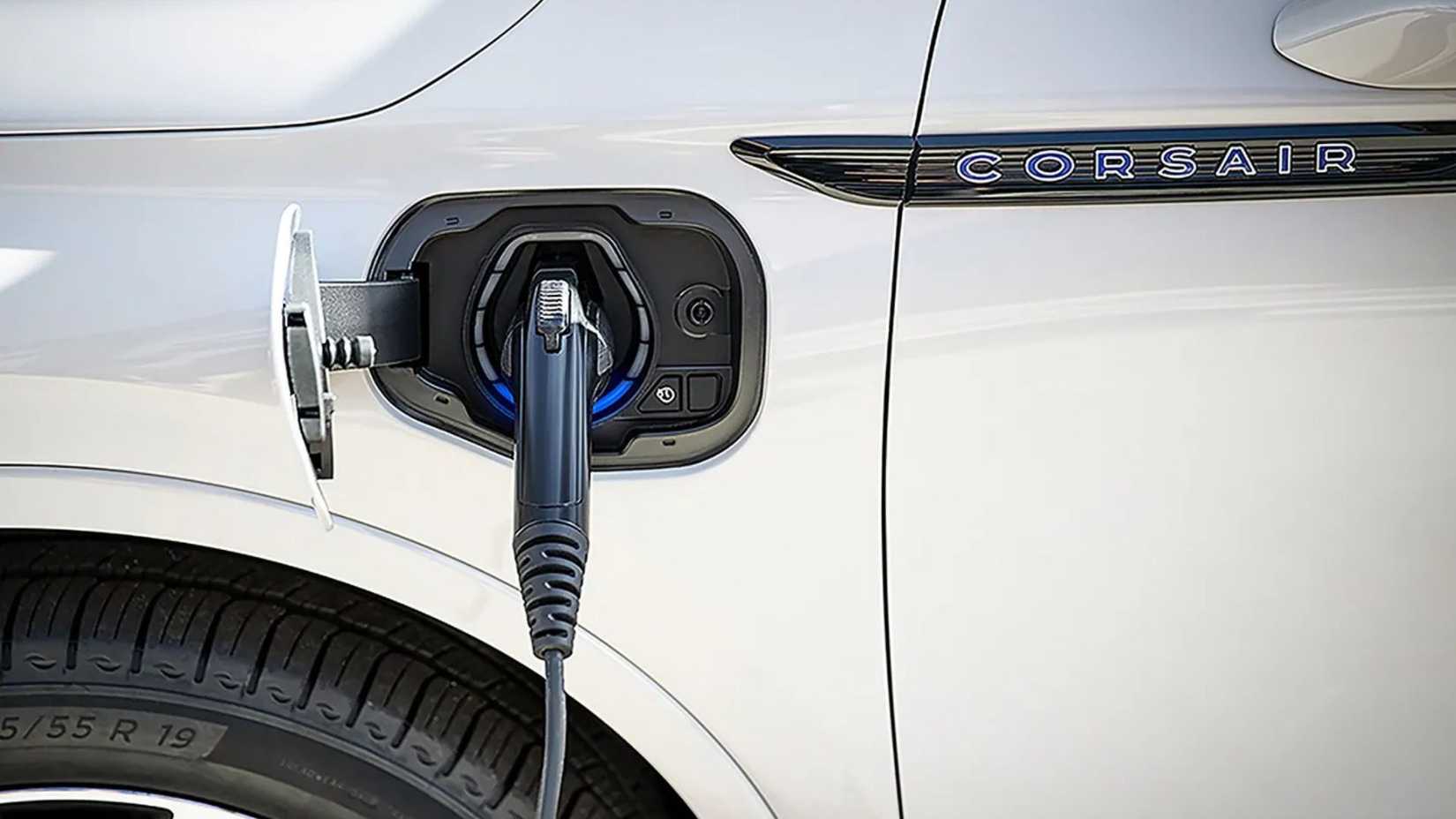 Close-up shot of the charging port on the wing of a white 2026 Lincoln Corsair PHEV.