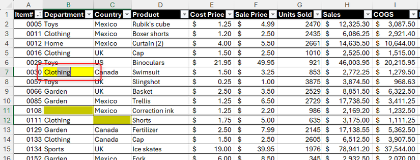 Uma célula em branco do Excel, destacada em amarelo, está sendo preenchida com a palavra “roupas”.