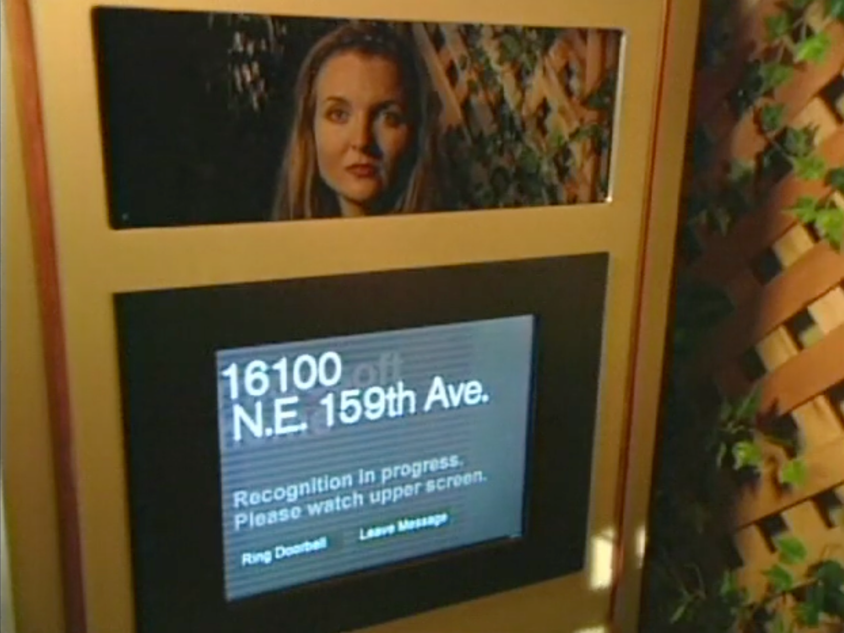 A person scanning their face to unlock their front door.