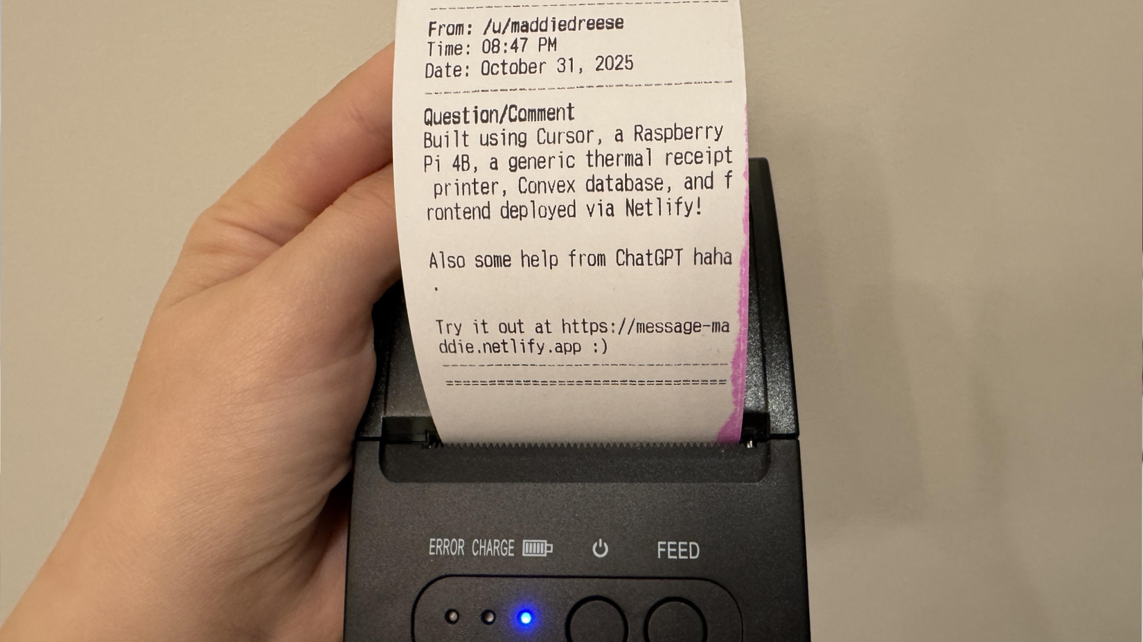 A thermal receipt printer showing a message sent via a website to a Raspberry Pi being printed.