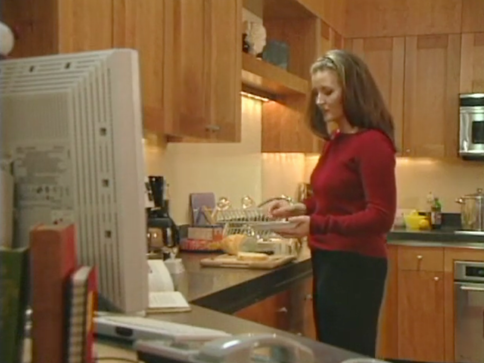 A woman adding an item to a shopping list using a voice assistant.