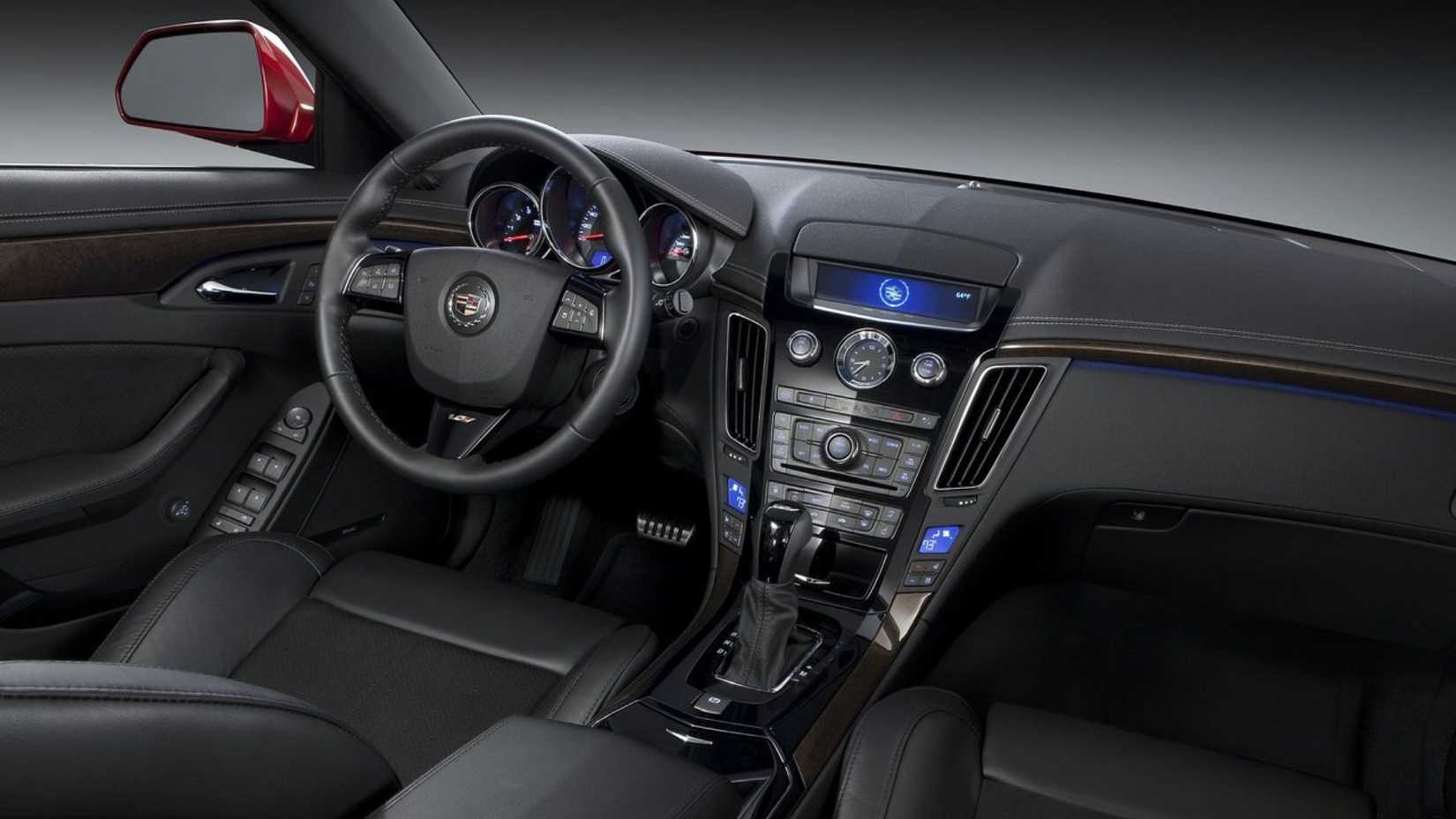 Shot inside the cabin of a 2011 Cadillac CTS-V Wagon, showing the interior andf dashboard.