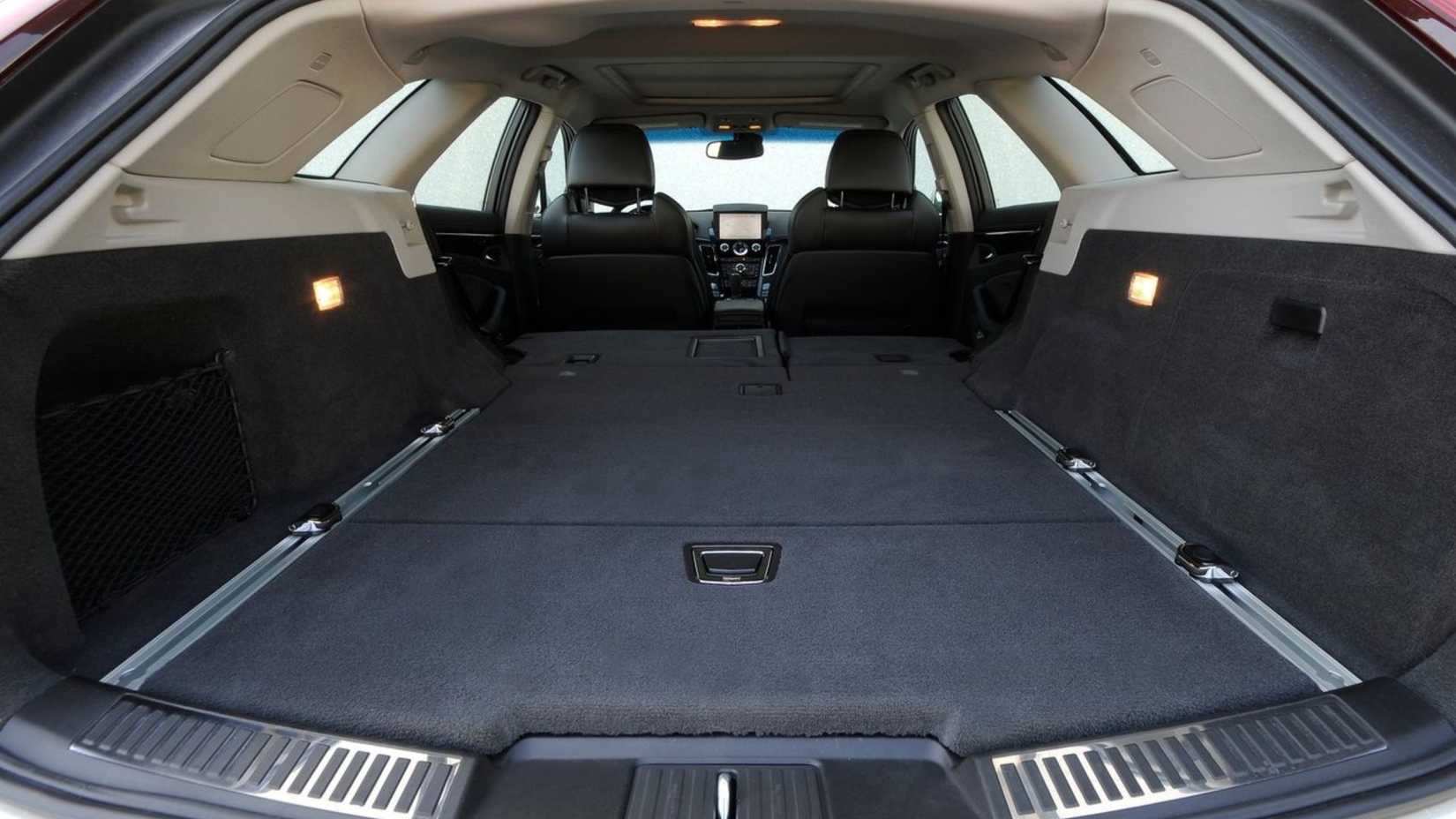 Close-up shot inside the trunk of a 2011 Cadillac CTS-V Wagon with the rear seats folded flat.