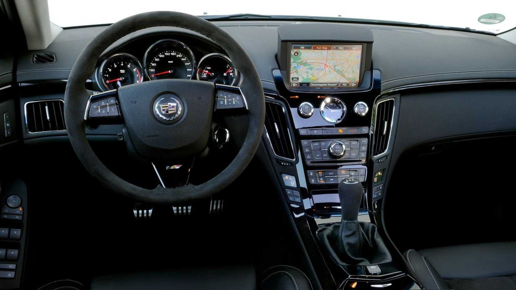 Close-up shot of the steering wheel and center console in a 2011 Cadillac CTS-V Wagon.