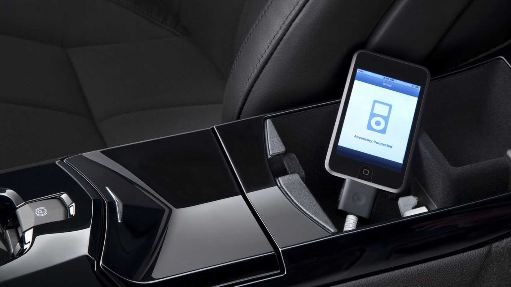 Close-up shot of an iPod plugged into the aux of a 2011 Cadillac CTS-V Wagon.