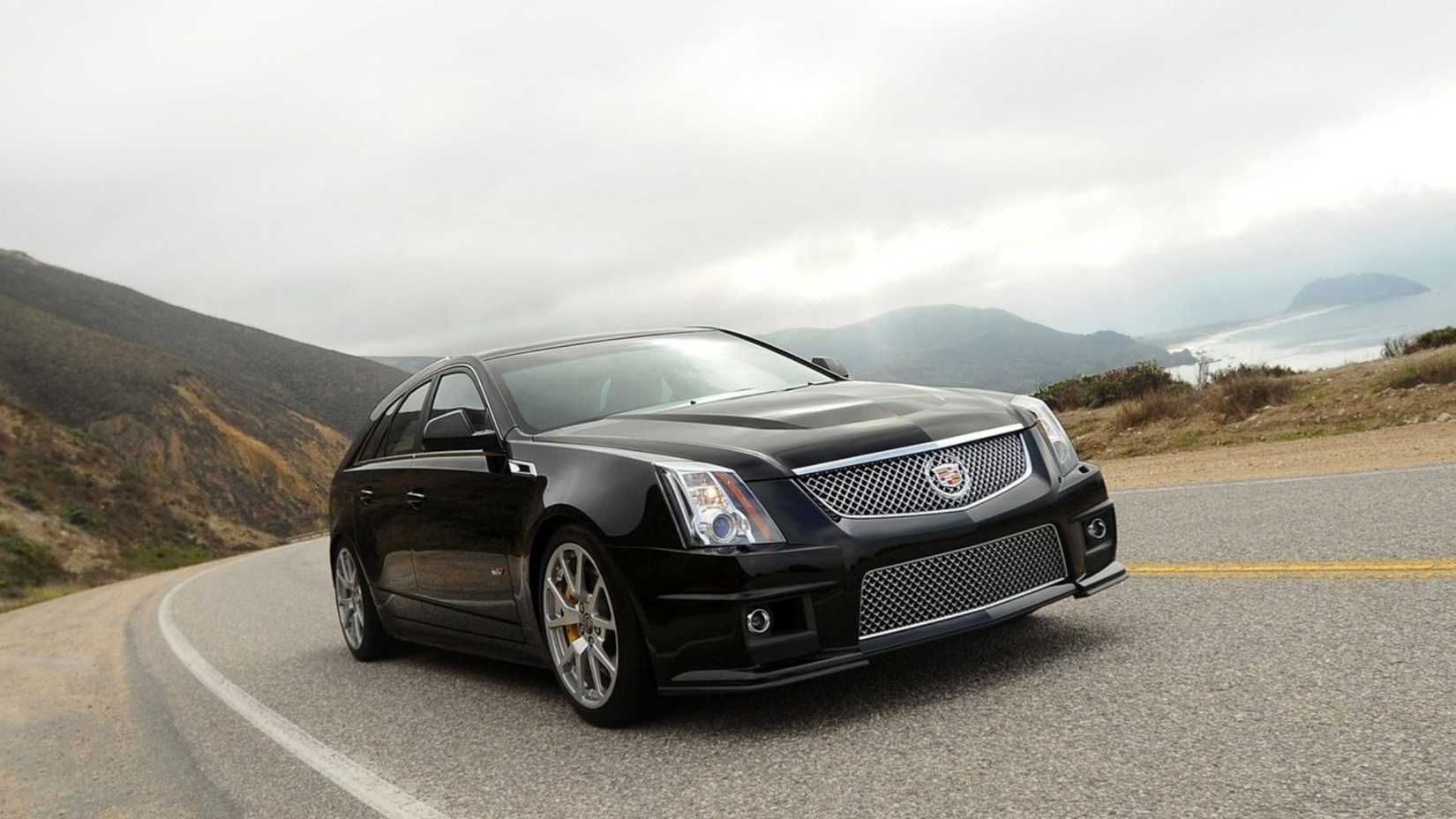 Static front 3/4 shot of a black 2011 Cadillac CTS-V Wagon.