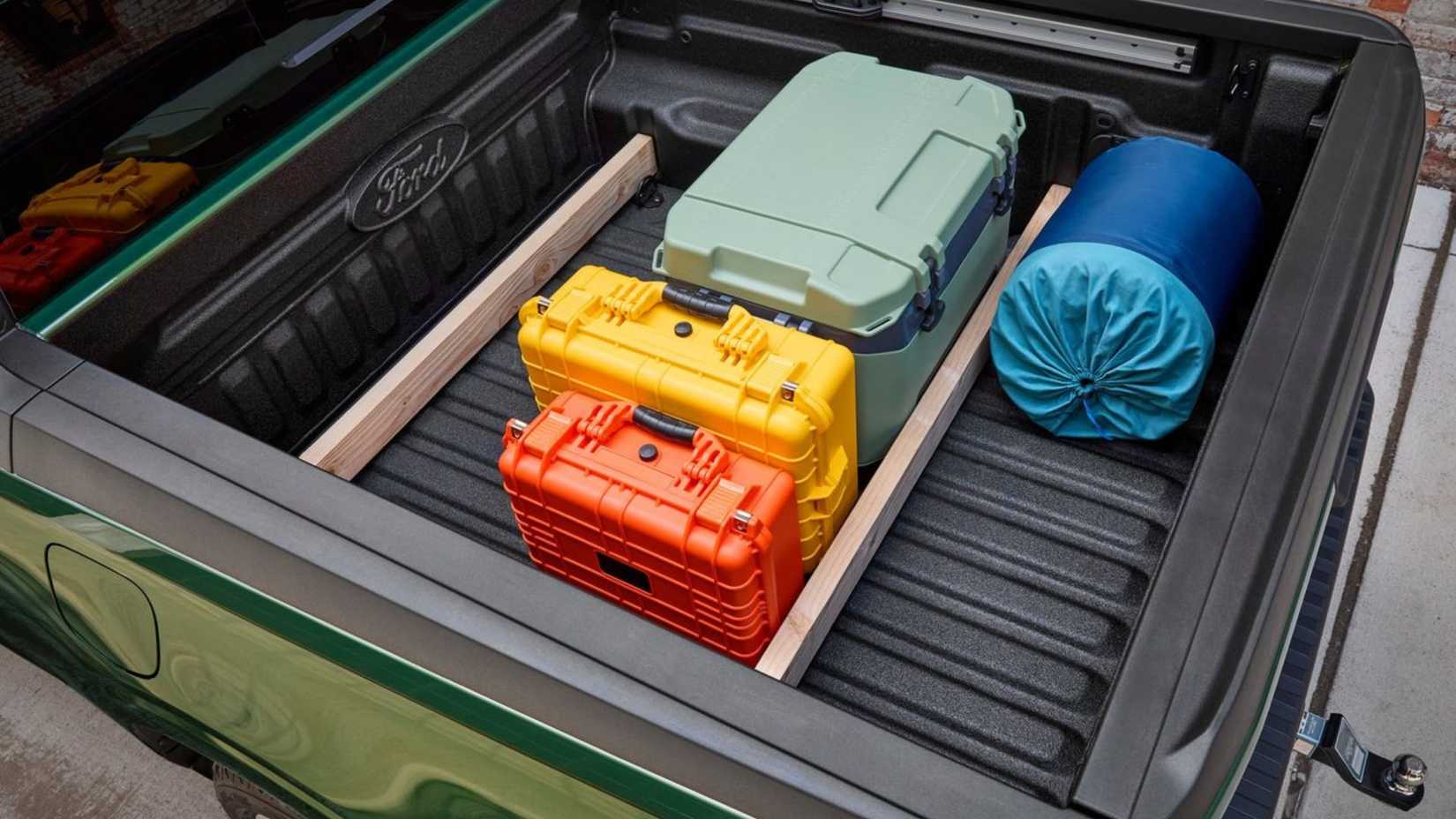 Shot of the bed of a 2025 Ford Maverick with equipment stowed away.