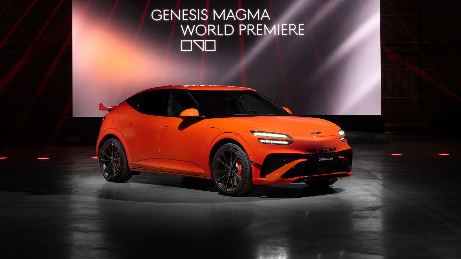 Still 3/4 front shot of the Genesis GV60 Magma at the world premiere.