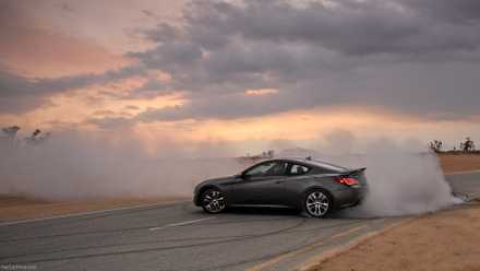 Side action shot of a 2013 Hyundai Genesis Coupe drifiting