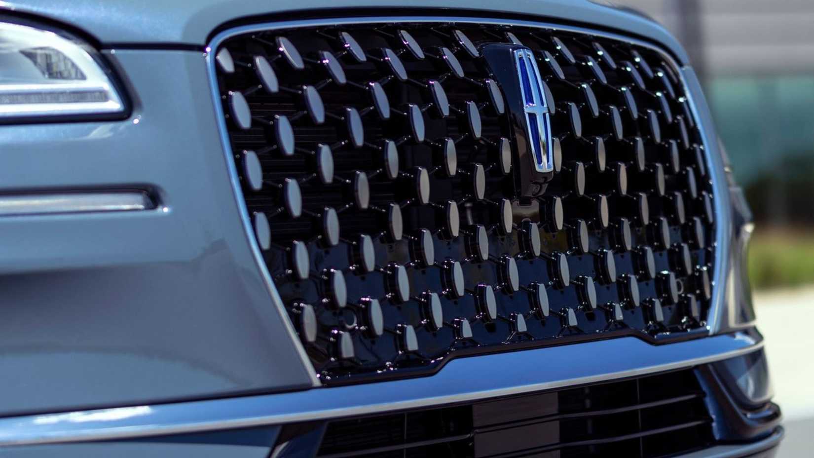 Close-up shot of the front grille on a gray 2023 Lincoln Corsair.