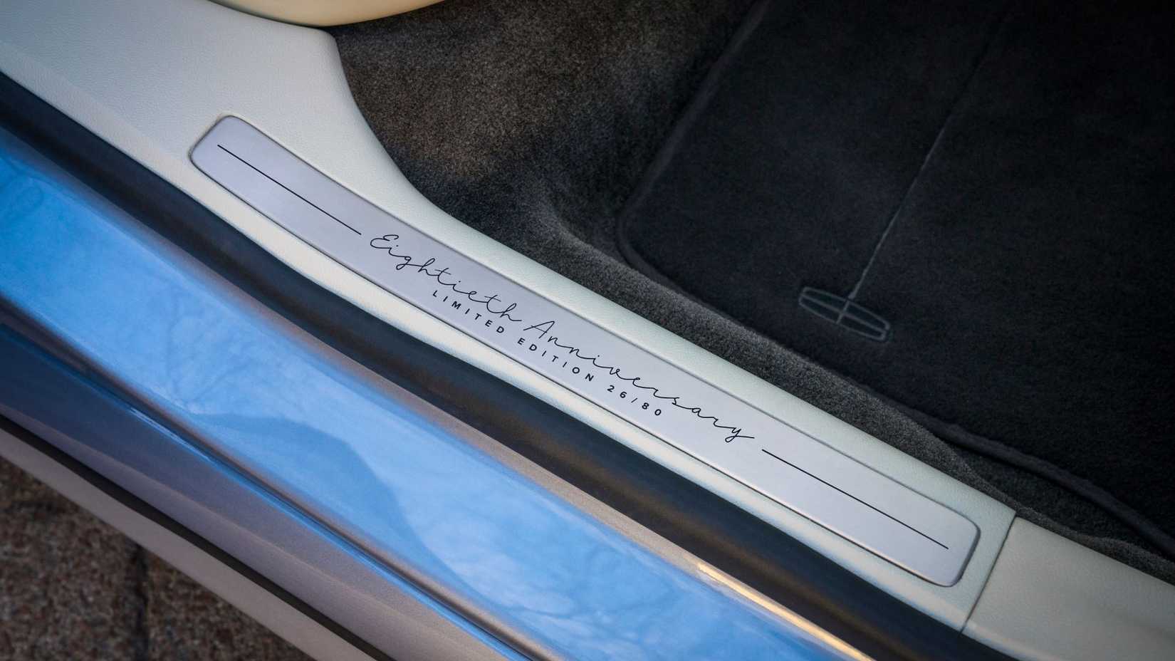 Close-up shot of the lettering on the rocker panels of a Lincoln Continental Coach Doors.