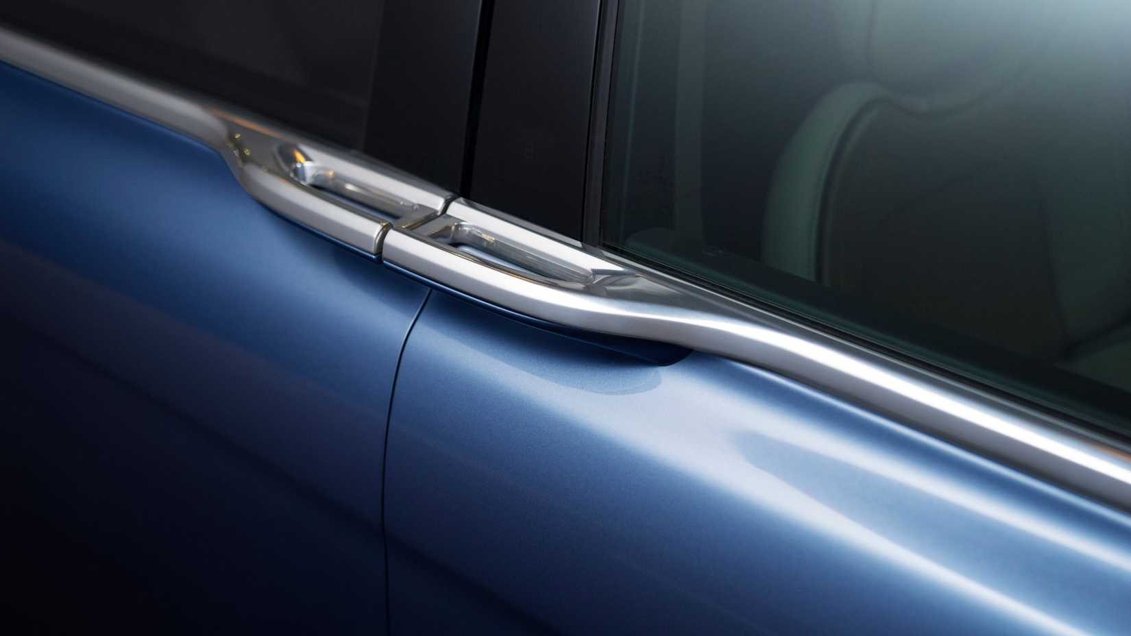 Close-up shot of the handles on the doors of a Lincoln Continental Coach Doors.