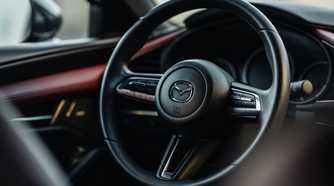 Close up of the steering wheel in a 2021 Mazda 3