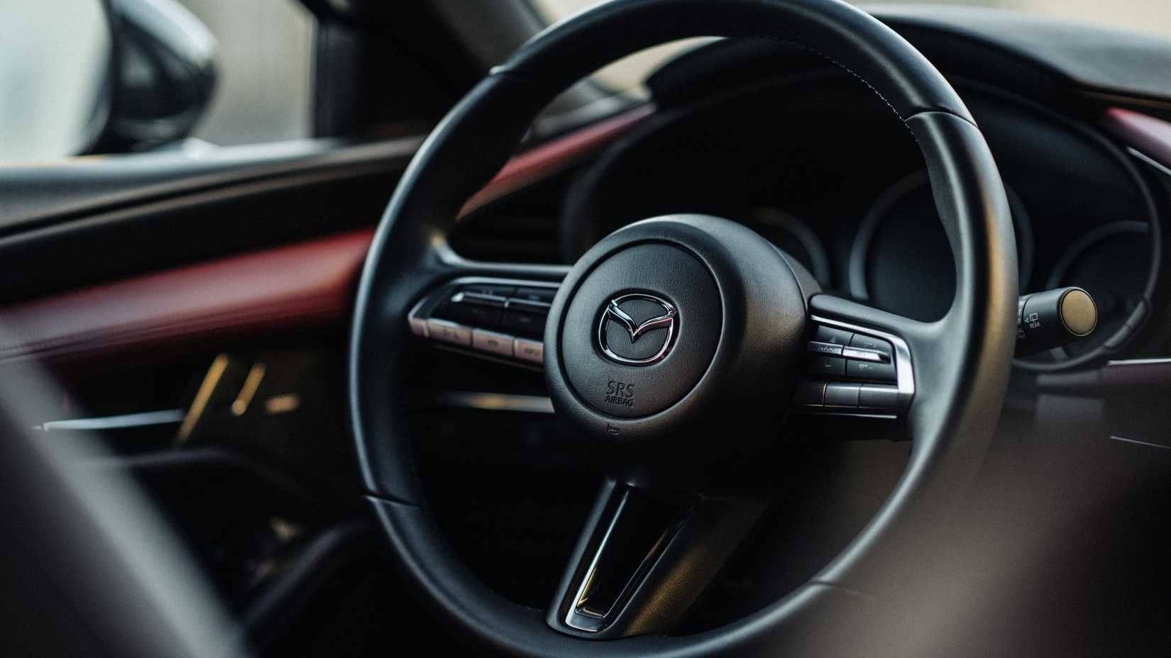 Close up of the steering wheel in a 2021 Mazda 3