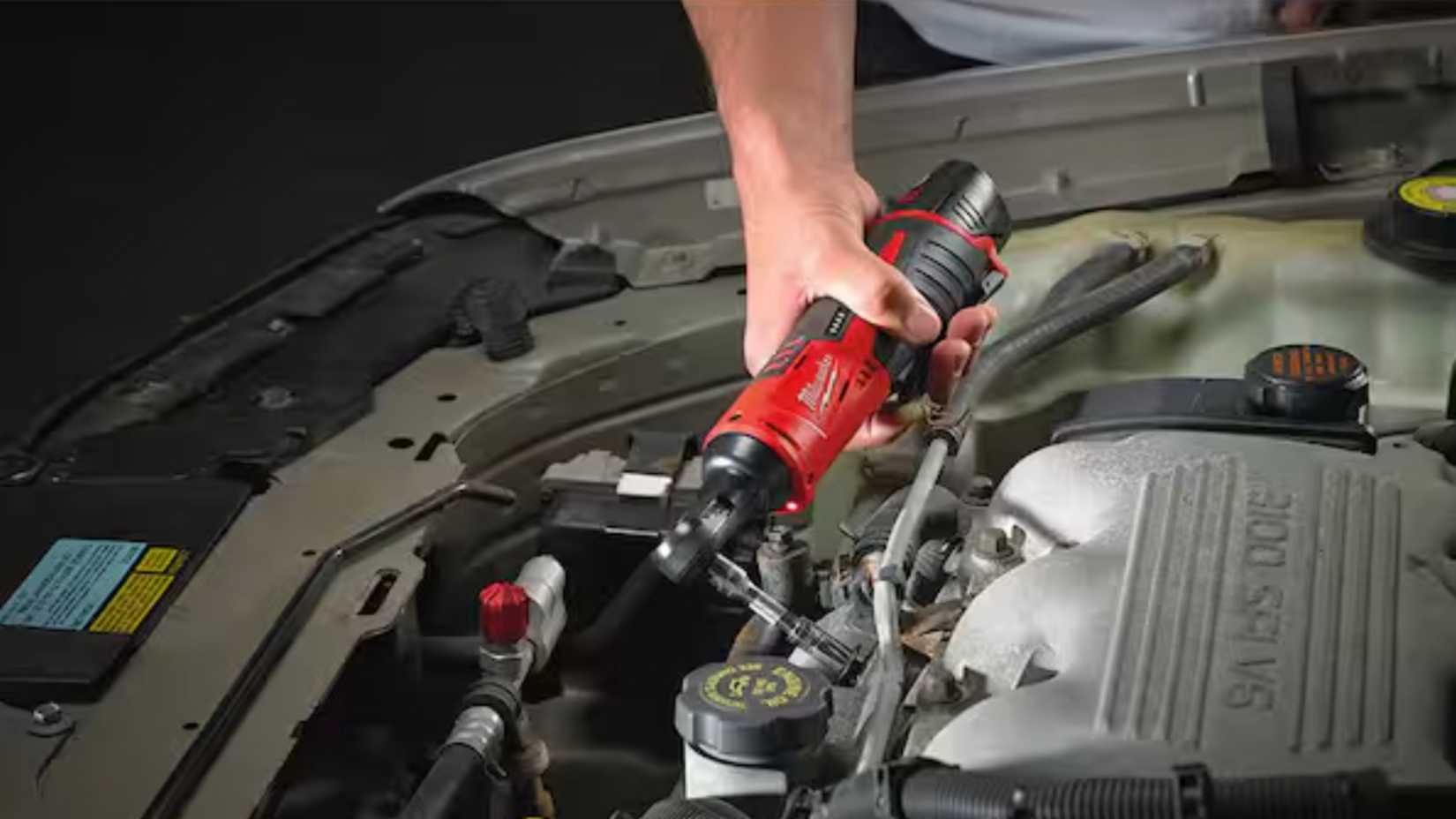 Milwaukee cordless ratchet working on a car. 