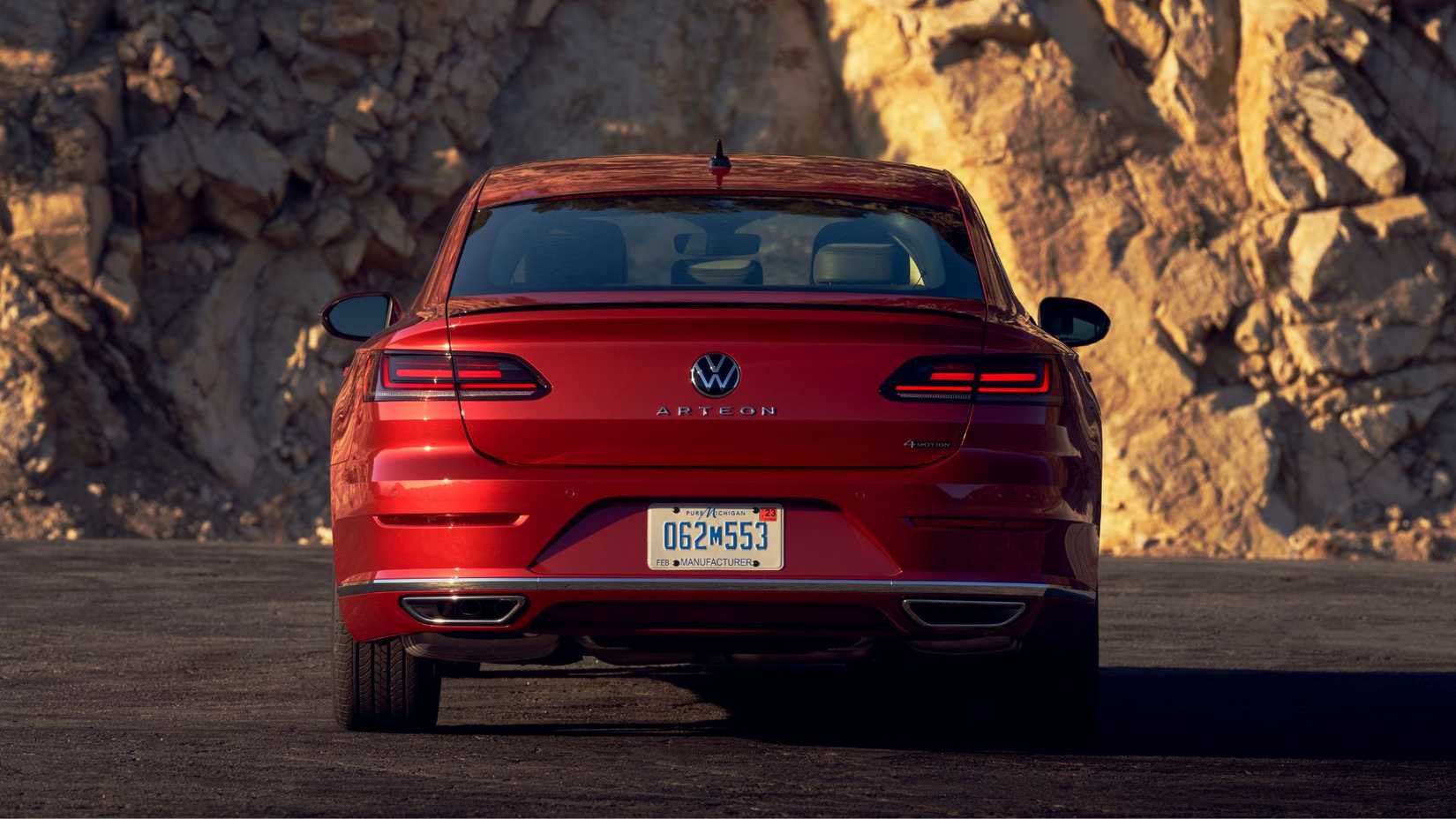 Static rear-end shot of a red 2021 Volkswagen Arteon.