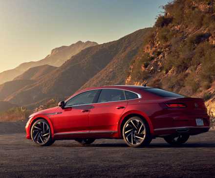 Static rear 3/4 shot of a red 2021 Volkswagen Arteon.