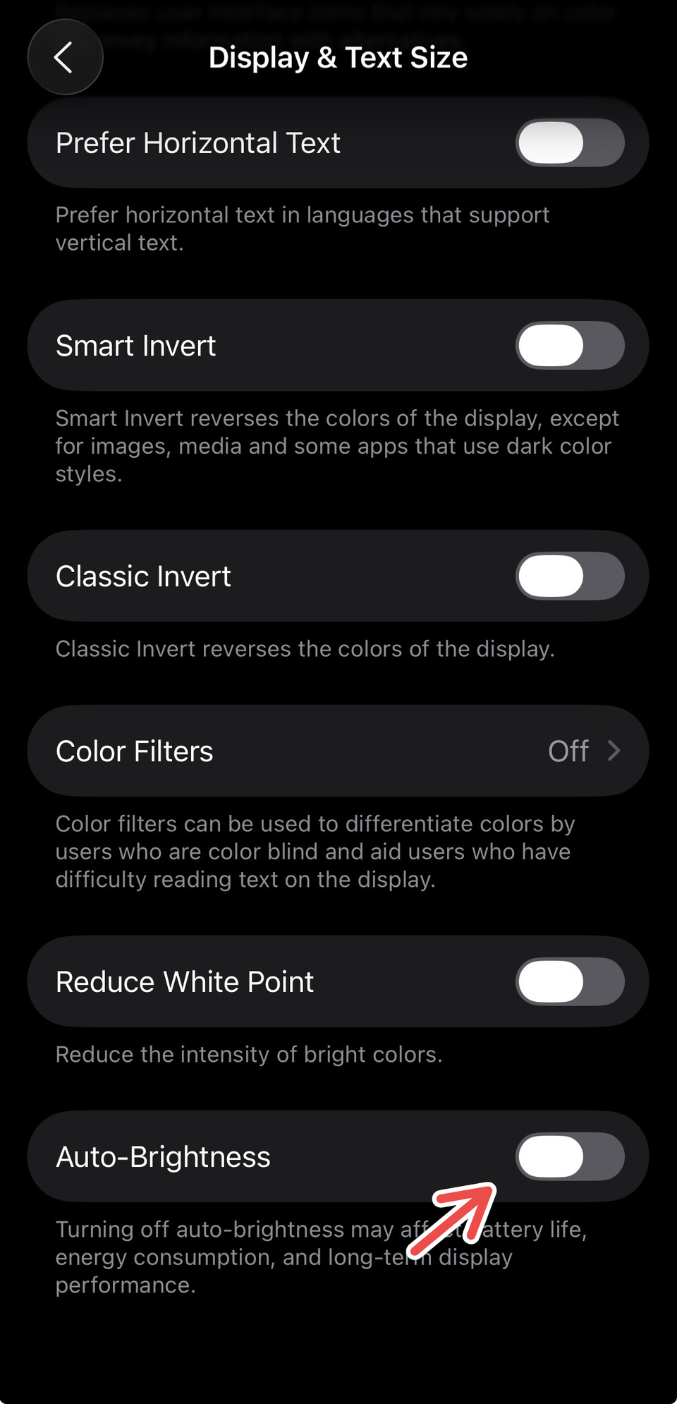 Disabling Auto-Brightness on iPhone settings.