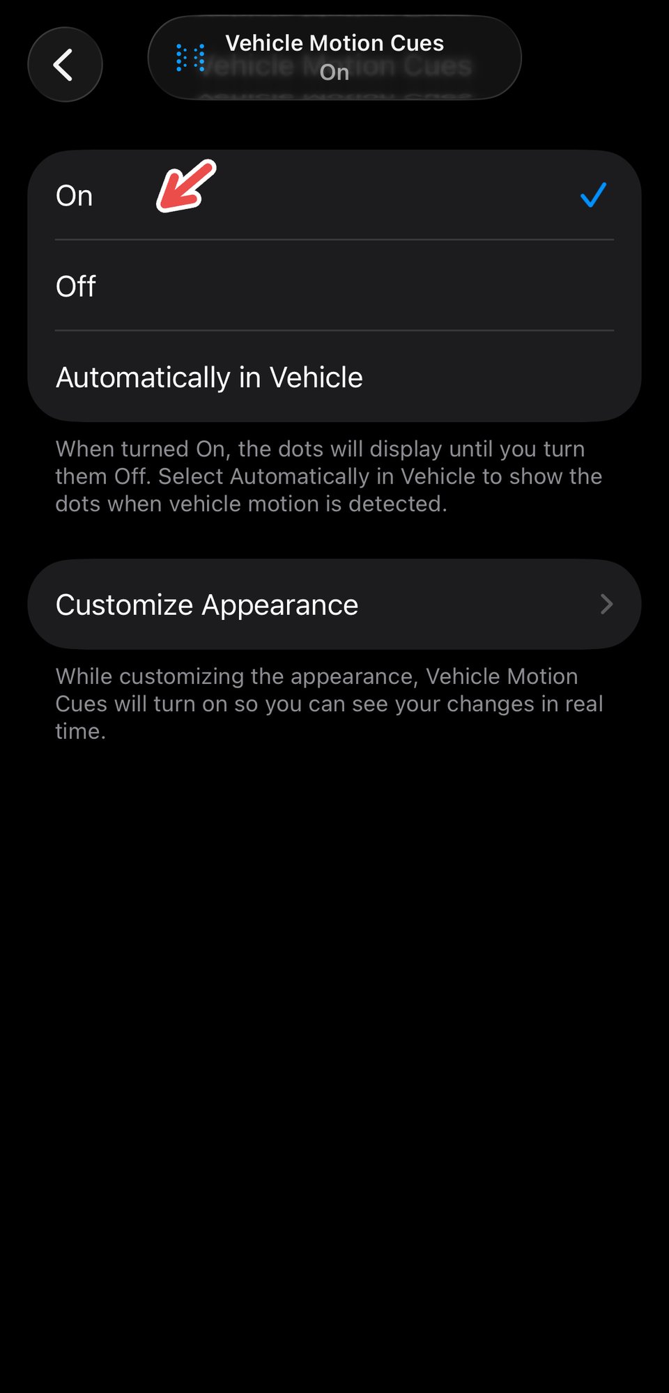 A screenshot on an iPhone showing Vehicle Motion Cues, with a red arrow pointing to "On."