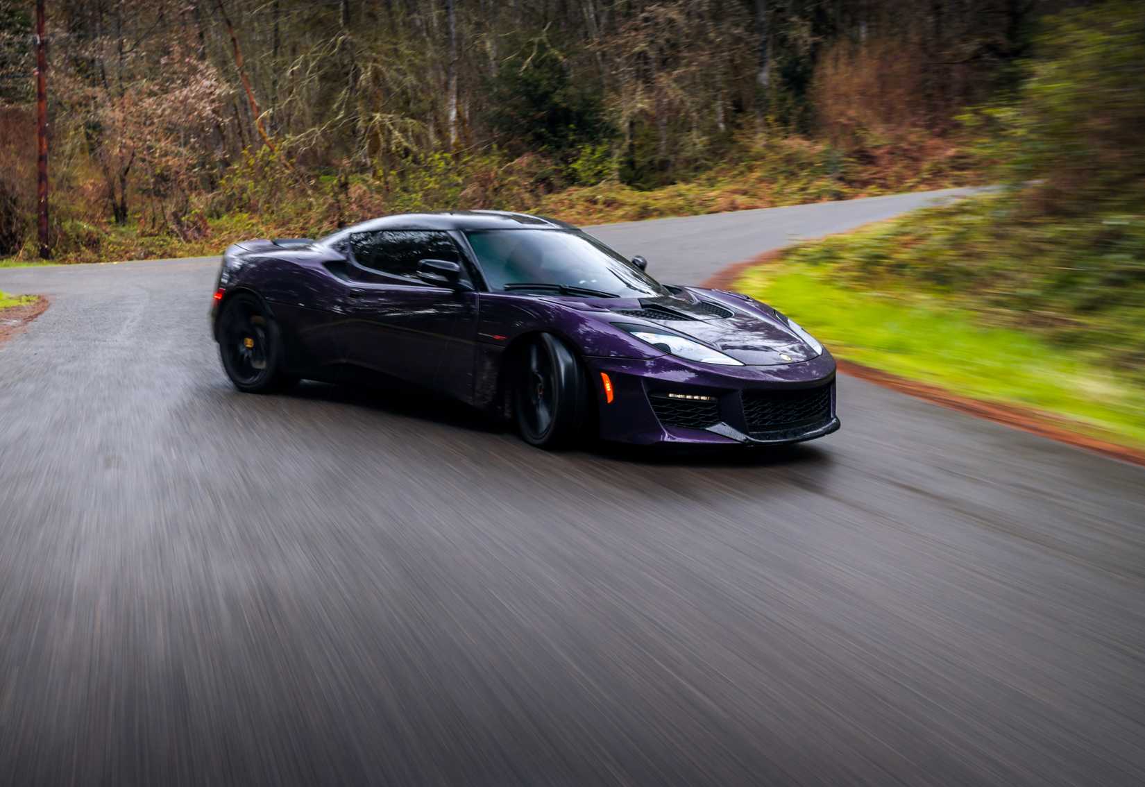 A sports car drifting around a corner.