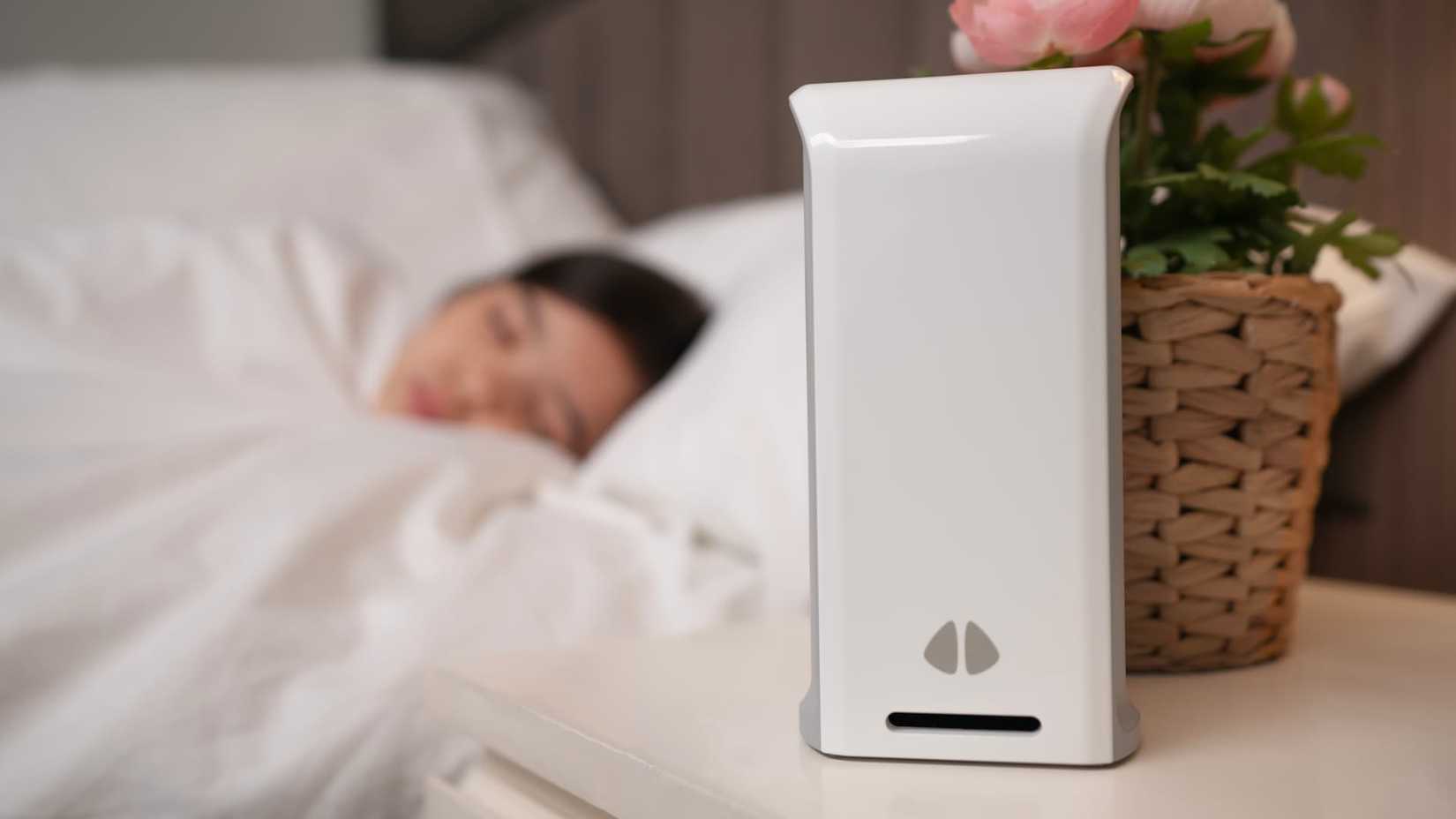 Someone sleeping near a uHoo Caeli on a desk