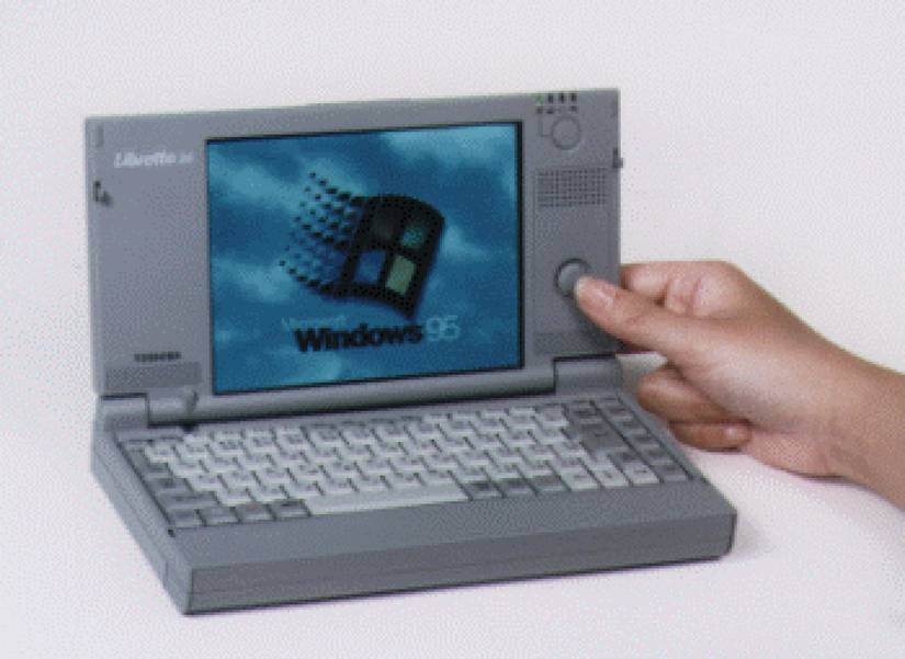 A Toshiba Libretto 20 subnotebook with the Windows 95 logo on its screen. 