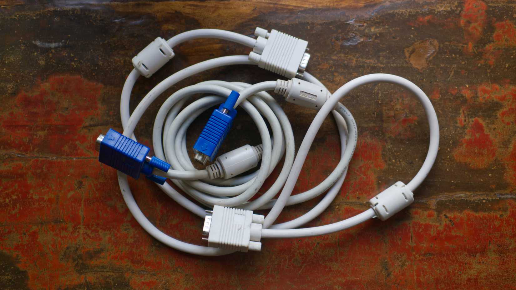 Two VGA cables intertwined.