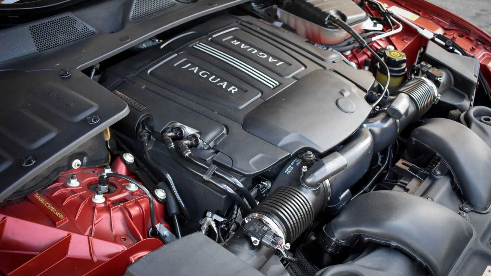 Close-up of the 5.0-liter supercharged V8 engine under the hood of the 2011 Jaguar XJL Supersport.