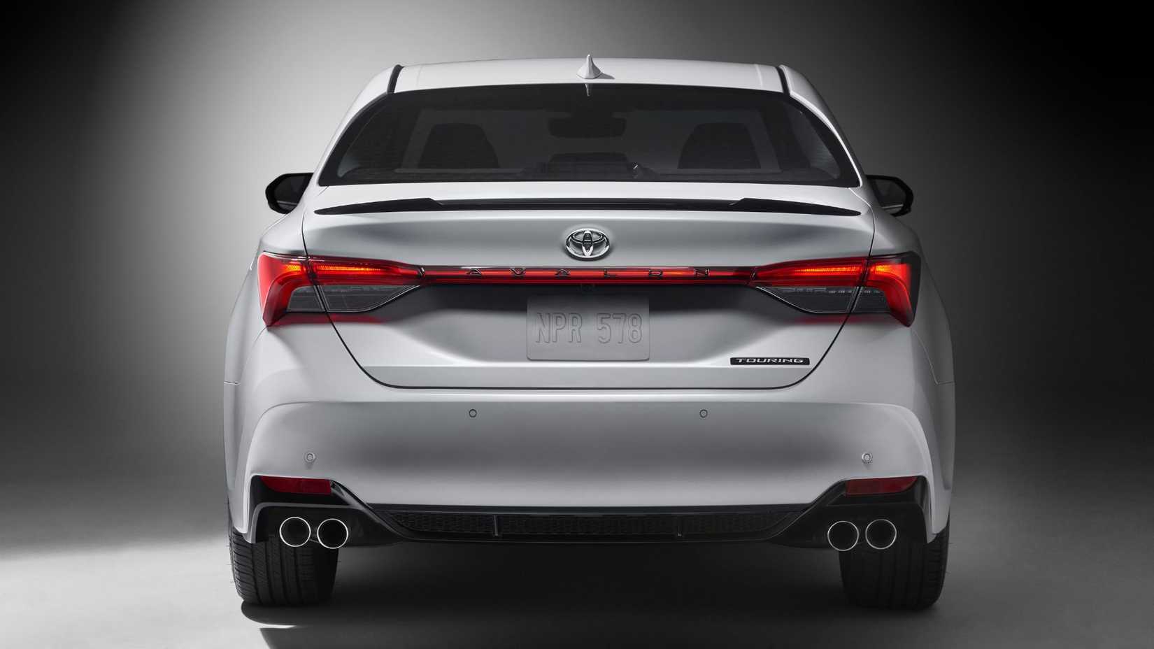Static rear-end shot of a white 2022 Toyota Avalon Touring.