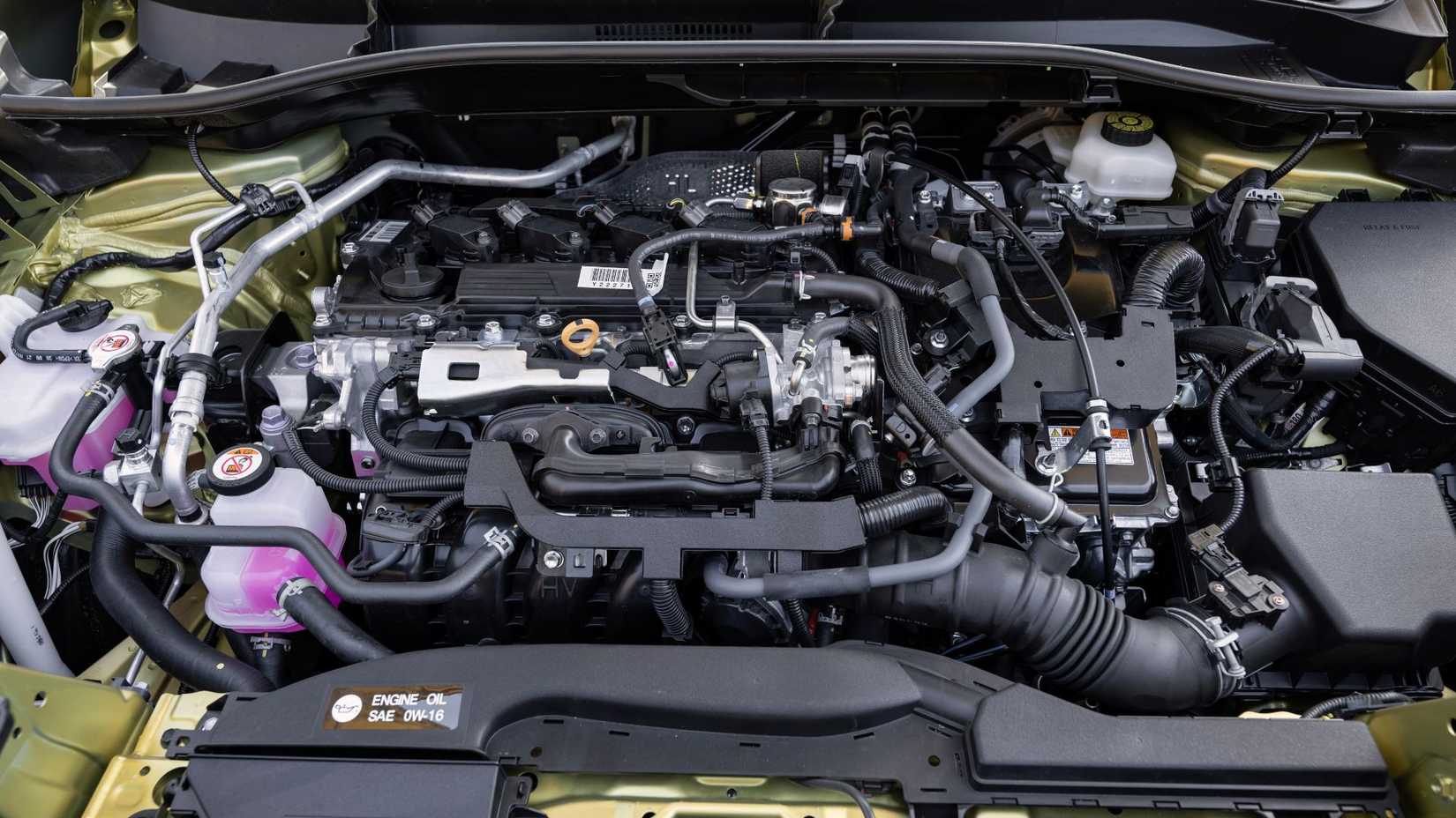 Close-up shot of the engine under the hood of a 2024 Toyota Corolla Cross Hybrid XSE.