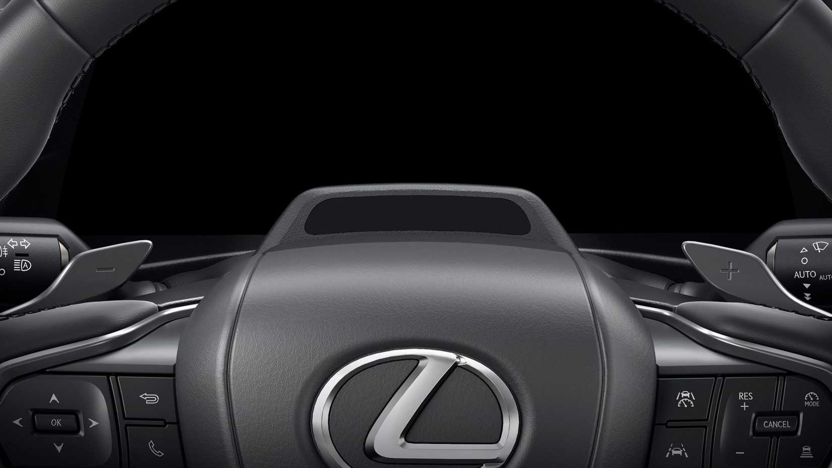 Close-up shot of the steering wheel in a 2026 Lexus IS 350.