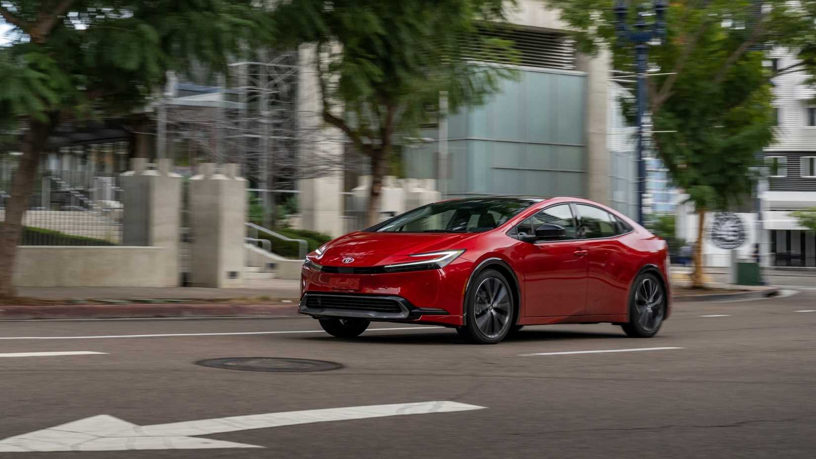 2026 Toyota Prius XLE in Supersonic Red, showcasing its bold color and advanced hybrid technology