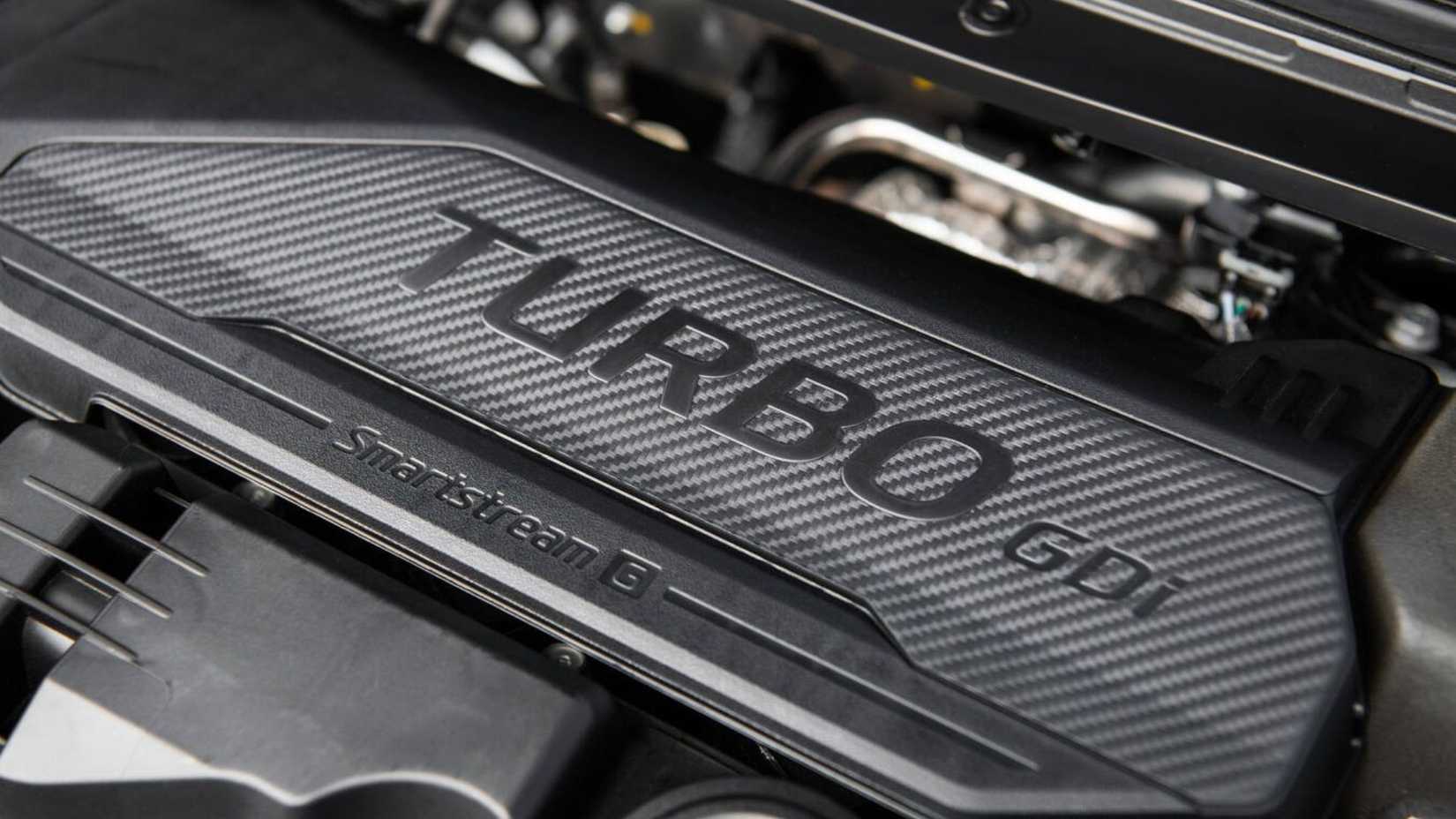 Close-up of the engine under the hood of a 2026 Kia K4.