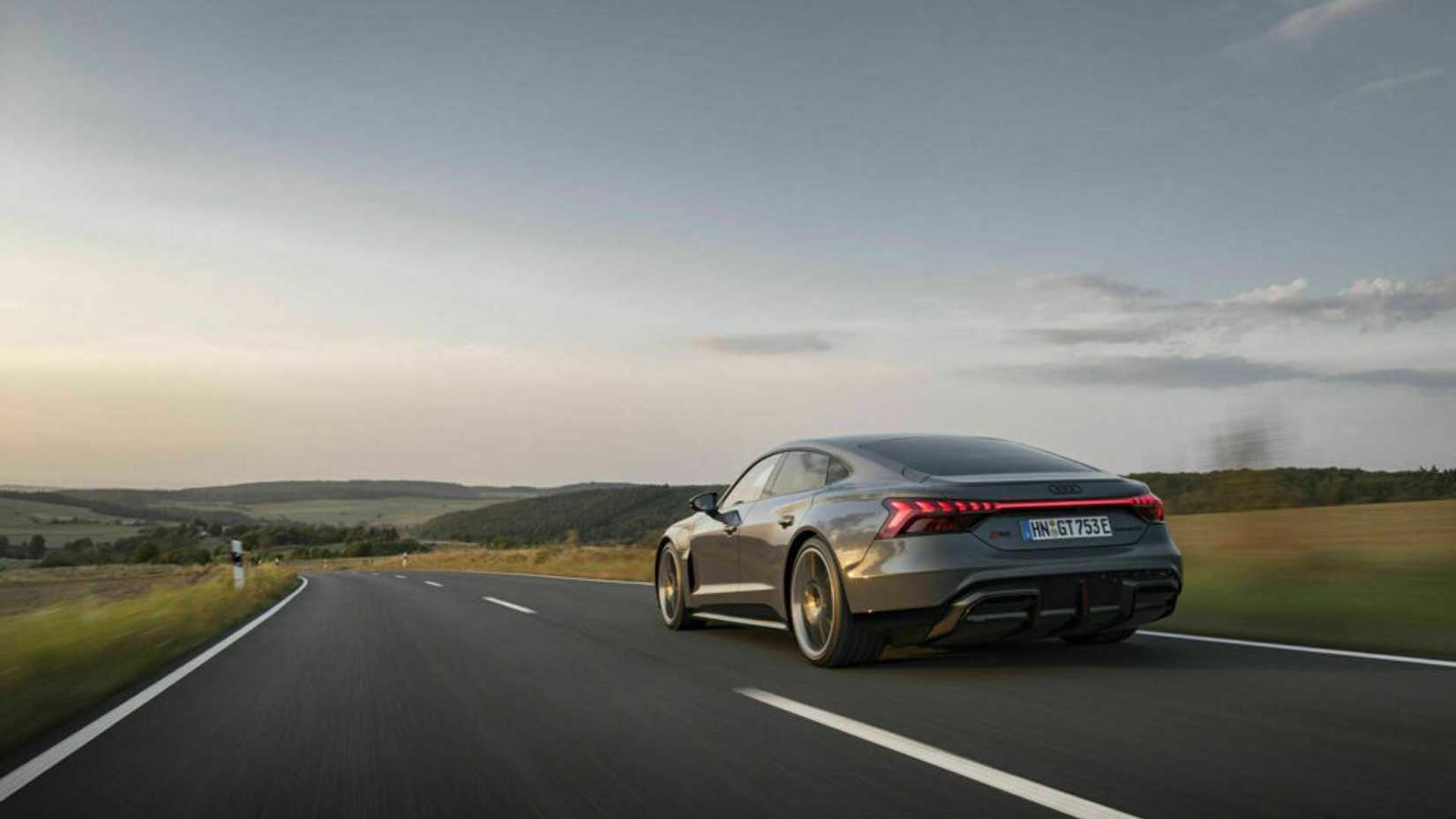 Dynamic rear view of the Audi RS e-tron GT in 3/4 scale.