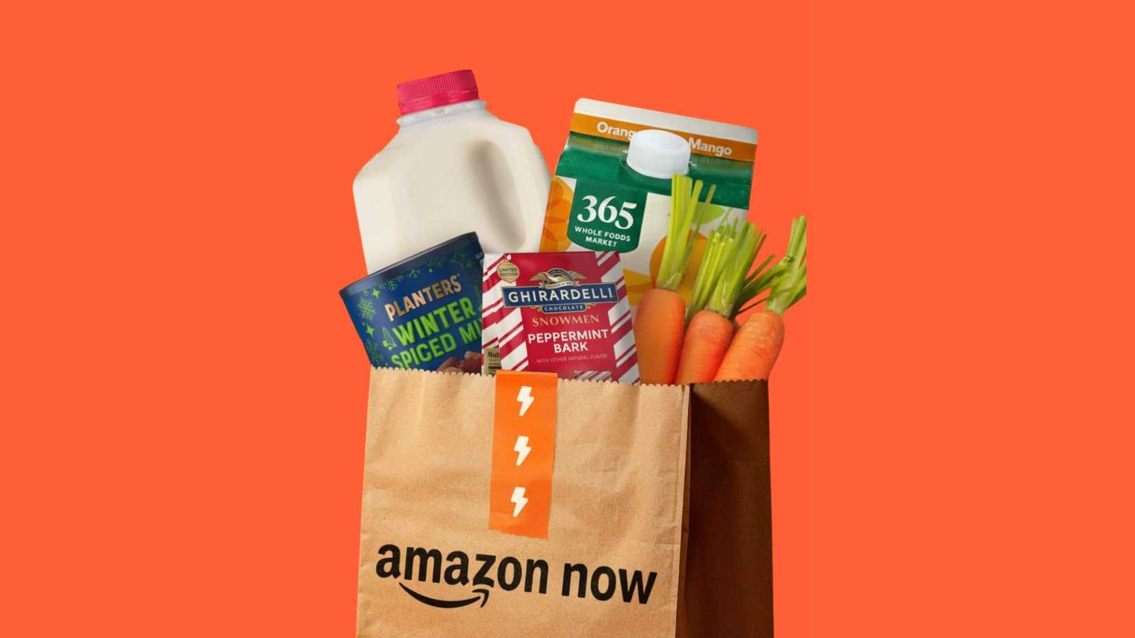 Amazon Now bag containing groceries on orange background