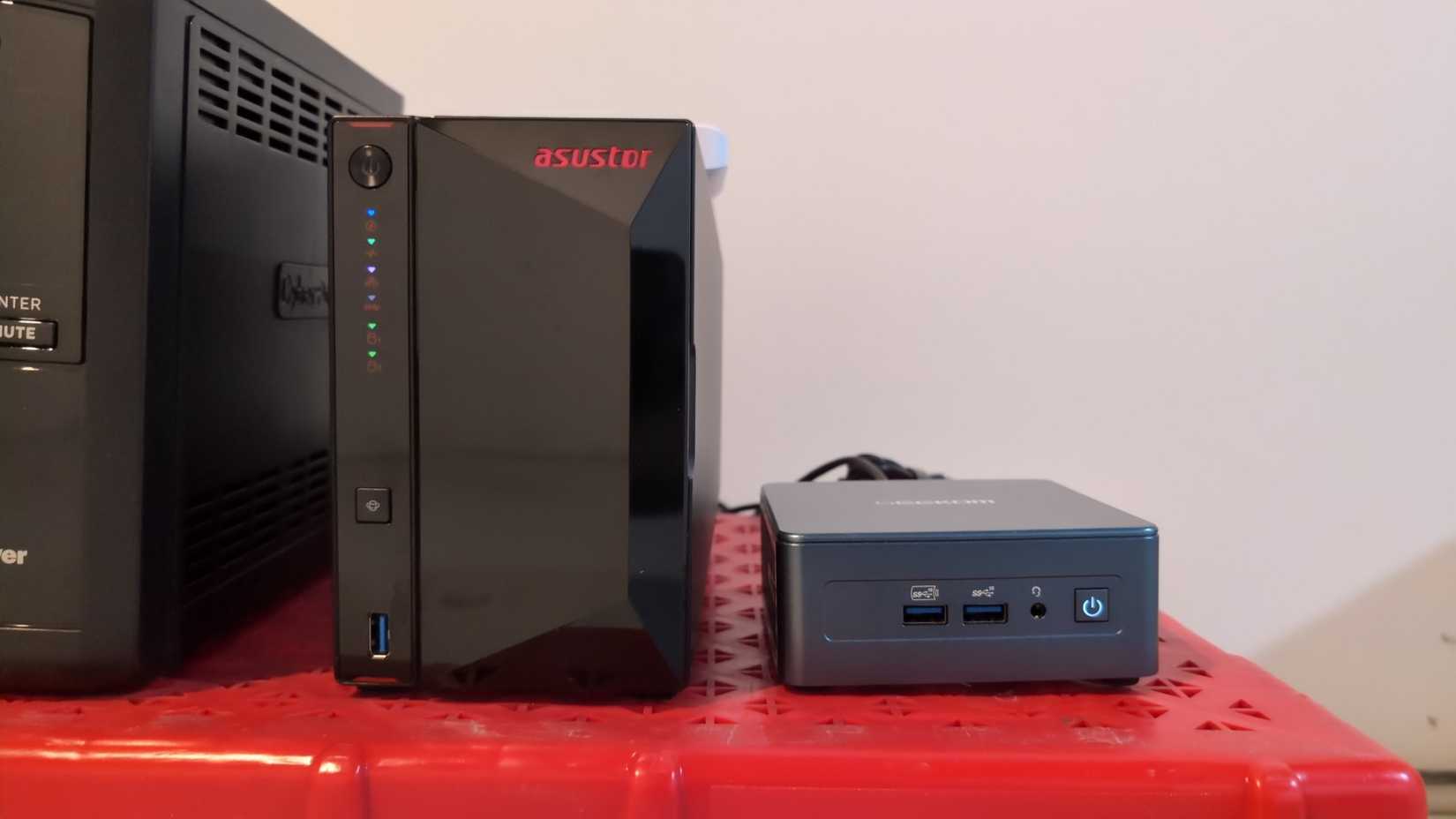 An Asustor NAS next to a Geekom mini PC.-2