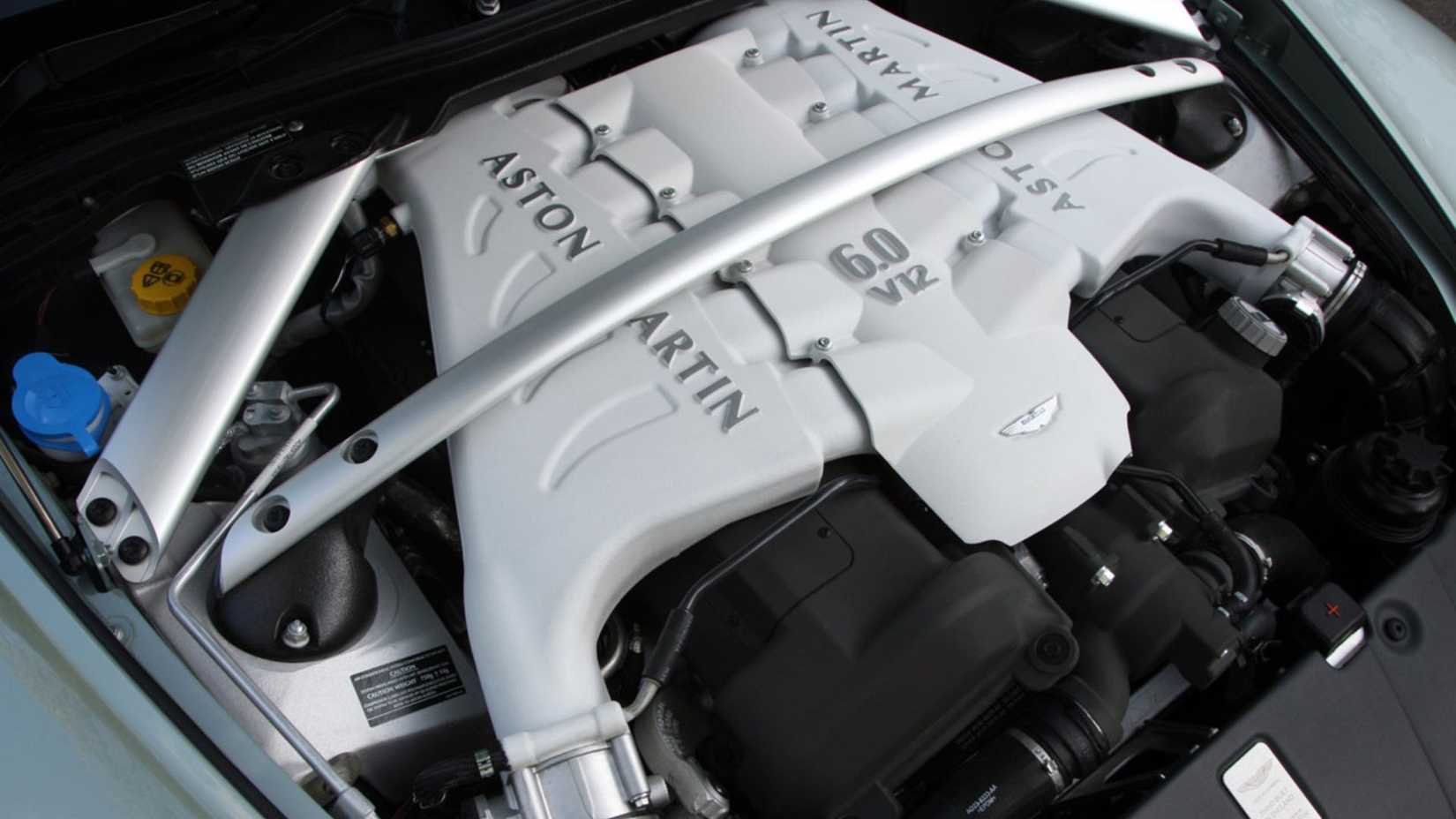 Close-up of the 6.0 liter naturally aspirated V12 engine under the hood of a 2010 Aston Martin V12 Vantage.
