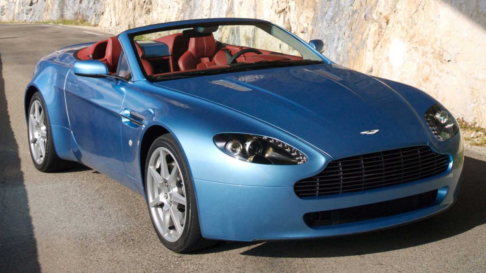 Static 3/4 front shot of a blue 2007 Aston Martin V8 Vantage Roadster.