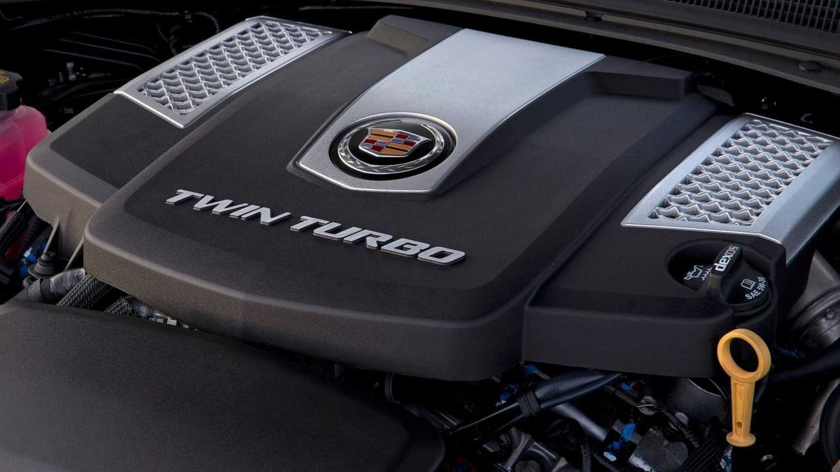 Close-up shot of the 3.6-liter twin-turbo V6 under the hood of a 2014 Cadillac CTS.