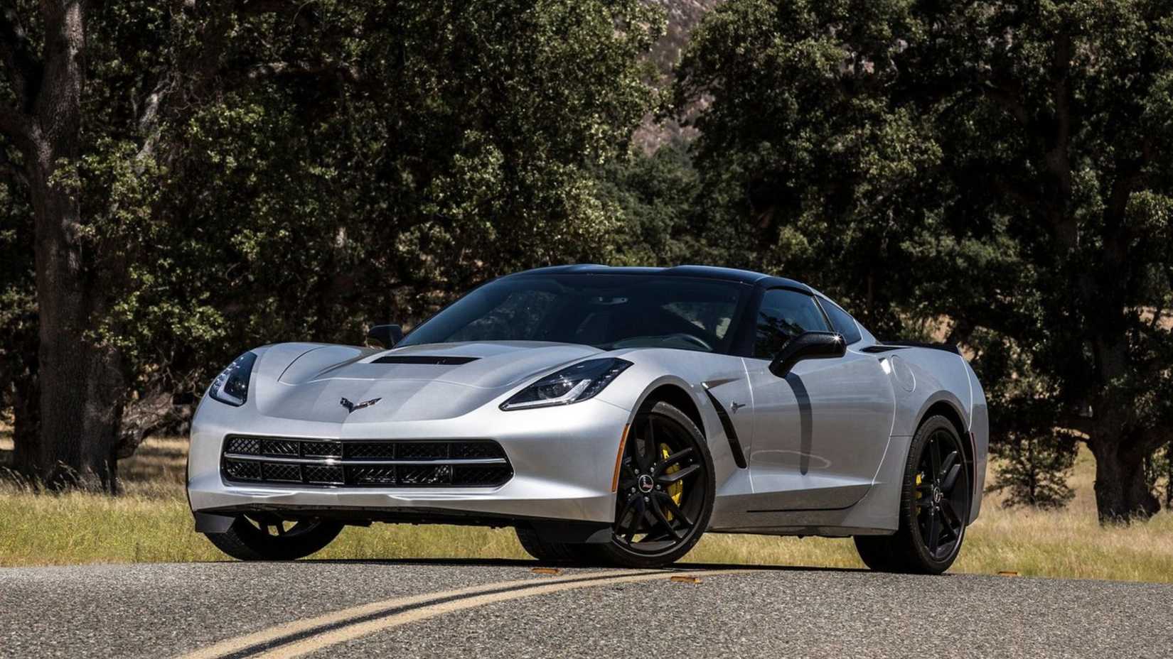 Static front 3/4 shot of a silver 2014 Chevrolet Corvette C7 Stingray.