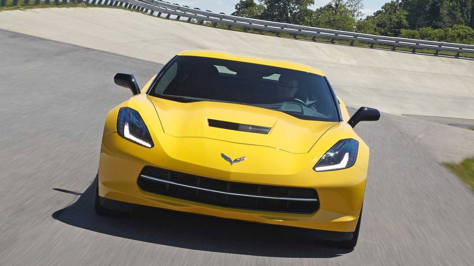 Dynamic front-end shot of yellow 2014 Chevrolet Corvette C7 Stingray.