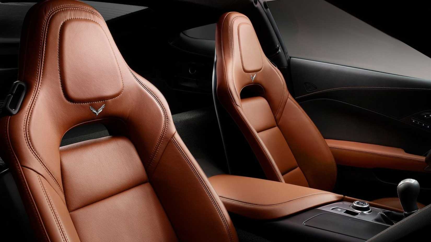 Shot inside the cabin of a 2014 Chevrolet Corvette C7 Stingray showing the tan leather sports seats.